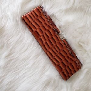 Animal print patent clutch